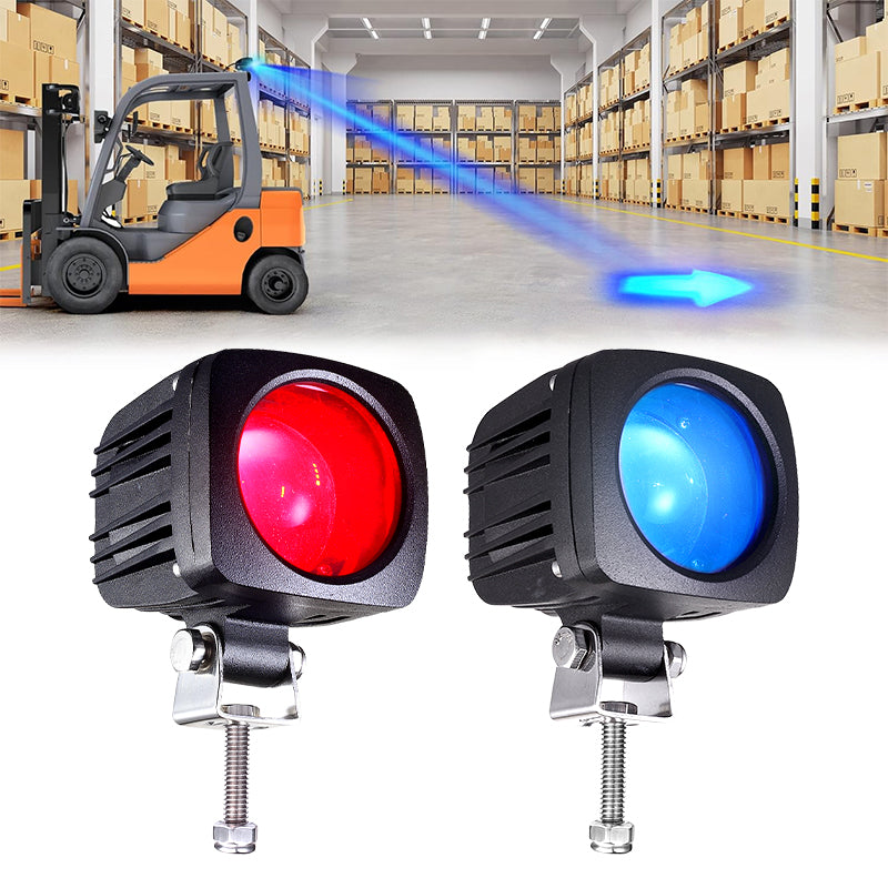 Blue arrow light on ground indicating forklift path