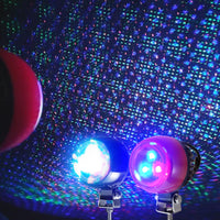 RGB Starry Laser Projector creating colorful starry laser beam effects for cars, parties, and outdoor use.
