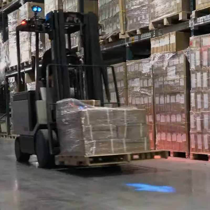 Directional arrow LED spotlight enhancing forklift safety
