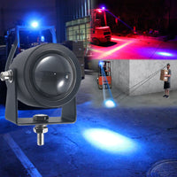 Forklift with mini blue beam light in dark warehouse