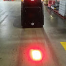 Forklift with mounted safety spotlight enhancing workplace security

