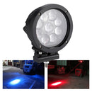 LED forklift spotlight projecting blue beam at night