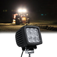 Square LED flood light mounted on construction vehicle