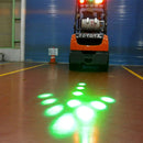 Warehouse worker near forklift with flashing LED safety light
